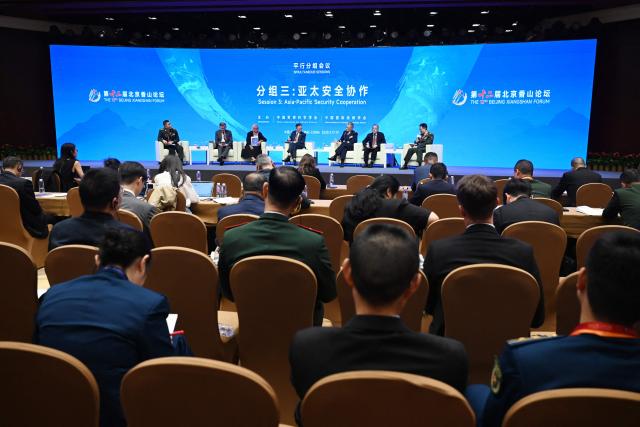 Delegates attend a panel discussion on Asia-Pacific Security Cooperation at the Xiangshan Forum at the Beijing International Convention Center in Beijing on September 18, 2025. (Photo by GREG BAKER / AFP)