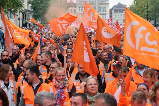 Members of the CFDT union demonstrate in Valenciennes, northern France, on September 18, 2025, during a day of nationwide strikes and protests called by unions over France's national budget. France is bracing for a day of nationwide protests on September 18, 2025, with a source close to the authorities saying some 800,000 people are expected to take to the streets. In a rare show of unity, trade unions have urged French people to strike in protest at the authorities' "horror show" draft budget designed to reduce France's ballooning debt. (Photo by Francois LO PRESTI / AFP)