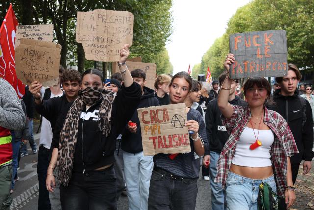 Youth demonstrate in Lorient, western France, on September 18, 2025, during a day of nationwide strikes and protests called by unions over France's national budget. France is bracing for a day of nationwide protests on September 18, 2025, with a source close to the authorities saying some 800,000 people are expected to take to the streets. In a rare show of unity, trade unions have urged French people to strike in protest at the authorities' "horror show" draft budget designed to reduce France's ballooning debt. (Photo by FRED TANNEAU / AFP)