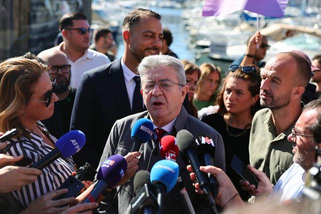 France's leftist La France Insoumise (LFI) party leader Jean-Luc Melenchon talks to the press next to LFI MP Manuel Bompard (R) in Marseille, southeastern France, on September 18, 2025, during a day of nationwide strikes and protests called by unions over France's national budget. France is bracing for a day of nationwide protests on September 18, 2025, with a source close to the authorities saying some 800,000 people are expected to take to the streets. In a rare show of unity, trade unions have urged French people to strike in protest at the authorities' "horror show" draft budget designed to reduce France's ballooning debt. (Photo by Clement MAHOUDEAU / AFP)