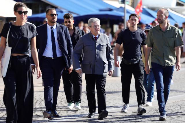 France's leftist La France Insoumise (LFI) party leader Jean-Luc Melenchon (C) and LFI MP Manuel Bompard (R) arrive to a demonstration in Marseille, southeastern France, on September 18, 2025, during a day of nationwide strikes and protests called by unions over France's national budget. France is bracing for a day of nationwide protests on September 18, 2025, with a source close to the authorities saying some 800,000 people are expected to take to the streets. In a rare show of unity, trade unions have urged French people to strike in protest at the authorities' "horror show" draft budget designed to reduce France's ballooning debt. (Photo by CLEMENT MAHOUDEAU / AFP)