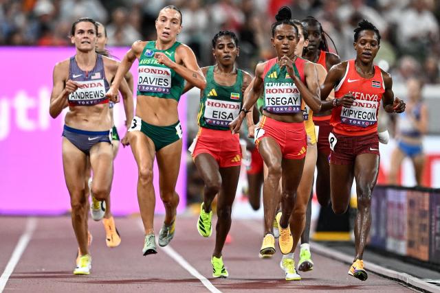 (From L) US' athlete Josette Andrews, Australia's Rose Davies, Ethiopia's Medina Eisa, Ethiopia's Gudaf Tsegay and Kenya's Faith Kipyegon compete in the women's 5000m heats during the World Athletics Championships in Tokyo on September 18, 2025. (Photo by Jewel SAMAD / AFP)