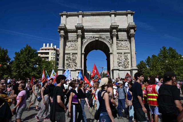 Protesters demonstrate in Marseille, southeastern France, on September 18, 2025, during a day of nationwide strikes and protests called by unions over France's national budget. France is bracing for a day of nationwide protests on September 18, 2025, with a source close to the authorities saying some 800,000 people are expected to take to the streets. In a rare show of unity, trade unions have urged French people to strike in protest at the authorities' "horror show" draft budget designed to reduce France's ballooning debt. (Photo by Miguel MEDINA / AFP)