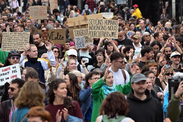 People demonstrate in Rennes, western France, on September 18, 2025, during a day of nationwide strikes and protests called by unions over France's national budget. France is bracing for a day of nationwide protests on September 18, 2025, with a source close to the authorities saying some 800,000 people are expected to take to the streets. In a rare show of unity, trade unions have urged French people to strike in protest at the authorities' "horror show" draft budget designed to reduce France's ballooning debt. (Photo by Damien MEYER / AFP)