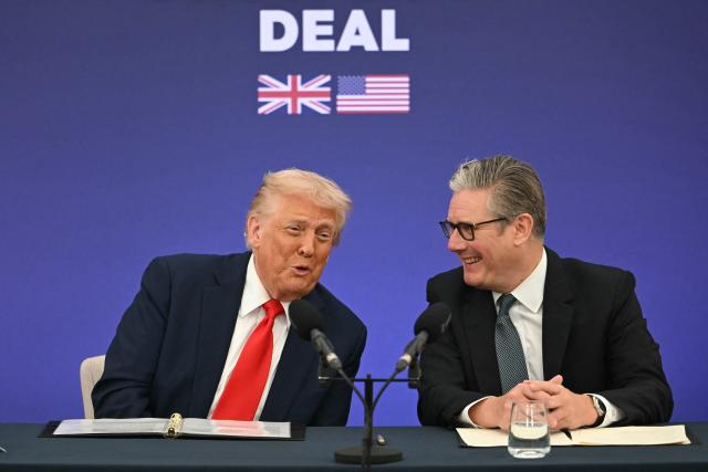 Britain's Prime Minister Keir Starmer (R) and US President Donald Trump (L) laugh together as Trump speaks at the start of a Business event where the two leaders announce technology and business deals at Chequers, in Aylesbury, central England, on September 18, 2025, on the second day of the US President's second State Visit. After the royal hospitality and pageantry, US President Donald Trump's unprecedented second state visit to the UK takes a serious turn on Thursday when he is hosted by Prime Minister Keir Starmer for wide-ranging talks. (Photo by ANDREW CABALLERO-REYNOLDS / AFP)