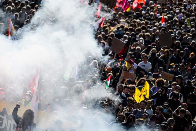 Protesters hold unions' flags and banners as they take part to a demonstration in Nantes, western France, on September 18, 2025, part of a day of nationwide strikes and protests called by unions over France's national budget. France is bracing for a day of nationwide protests on September 18, 2025, with a source close to the authorities saying some 800,000 people are expected to take to the streets. In a rare show of unity, trade unions have urged French people to strike in protest at the authorities' "horror show" draft budget designed to reduce France's ballooning debt. (Photo by Loic VENANCE / AFP)