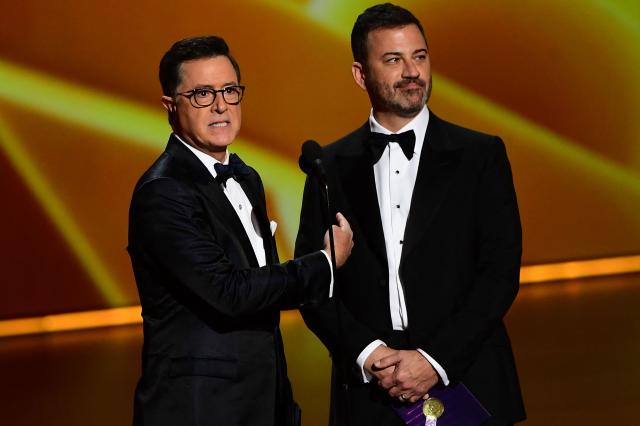 (FILES) Stephen Colbert (L) and Jimmy Kimmel speak onstage during the 71st Emmy Awards at the Microsoft Theatre in Los Angeles on September 22, 2019. Jimmy Kimmel's late-night show was pulled from the air on September 17, 2025, hours after the US government threatened to cancel broadcasting licenses because of comments the host made about the killing of conservative influencer Charlie Kirk. The stunning move by network ABC to remove one of America's most influential late-night shows was blasted by critics as government censorship but celebrated by Donald Trump, who has long chafed at the comedians who mock him. (Photo by Frederic J. BROWN / AFP)