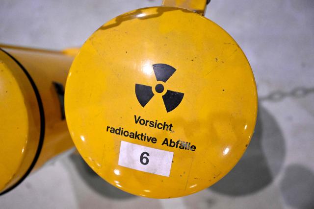 A photo shows a rubbish bin reading 'Caution - radioactive waste' at the Ahaus interim storage facility in Ahaus, western Germany on September 18, 2025. On August 26, 2025, the Federal Office for the Safety of Nuclear Waste Disposal (BASE) approved the controversial transport of nuclear waste from Juelich in the Rhineland to the interim storage facility in Ahaus in the Muensterland region. (Photo by Ina FASSBENDER / AFP)