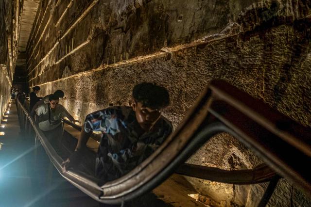 Tourists visit the inside of the Great Pyramid of Khufu, at the Giza Pyramids necropolis on the southwestern outskirts of the Egyptian capital Cairo on September 18, 2025. (Photo by Khaled DESOUKI / AFP)