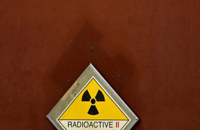 A photo shows a sign 'Radioactive' at a Castor container at the Ahaus interim storage facility in Ahaus, western Germany on September 18, 2025. On August 26, 2025, the Federal Office for the Safety of Nuclear Waste Disposal (BASE) approved the controversial transport of nuclear waste from Juelich in the Rhineland to the interim storage facility in Ahaus in the Muensterland region. (Photo by Ina FASSBENDER / AFP)