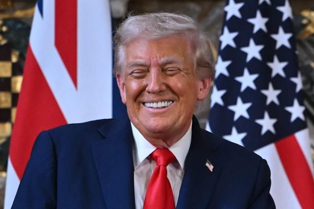 US President Donald Trump gestures as Britain's Prime Minister Keir Starmer (unseen) speaks during a joint press conference following their meeting at Chequers, in Aylesbury, central England, on September 18, 2025, on the second day of the US President's second State Visit. After the royal hospitality and pageantry, US President Donald Trump's unprecedented second state visit to the UK takes a serious turn on Thursday when he is hosted by Prime Minister Keir Starmer for wide-ranging talks. (Photo by ANDREW CABALLERO-REYNOLDS / AFP)