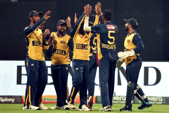 Sri Lanka's players celebrate after the dismissal of Afghanistan's Darwish Rasooli during the Asia Cup 2025 Twenty20 international cricket match between Afghanistan and Sri Lanka at the Sheikh Zayed Cricket Stadium in Abu Dhabi on September 18, 2025. (Photo by Fadel SENNA / AFP)