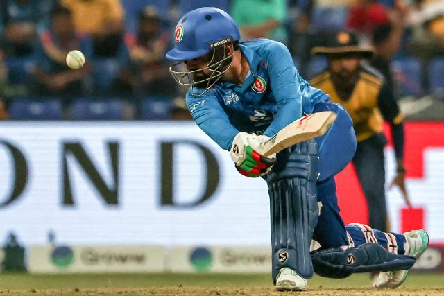 Afghanistan's captain Rashid Khan plays a shot during the Asia Cup 2025 Twenty20 international cricket match between Afghanistan and Sri Lanka at the Sheikh Zayed Cricket Stadium in Abu Dhabi on September 18, 2025. (Photo by Fadel SENNA / AFP)