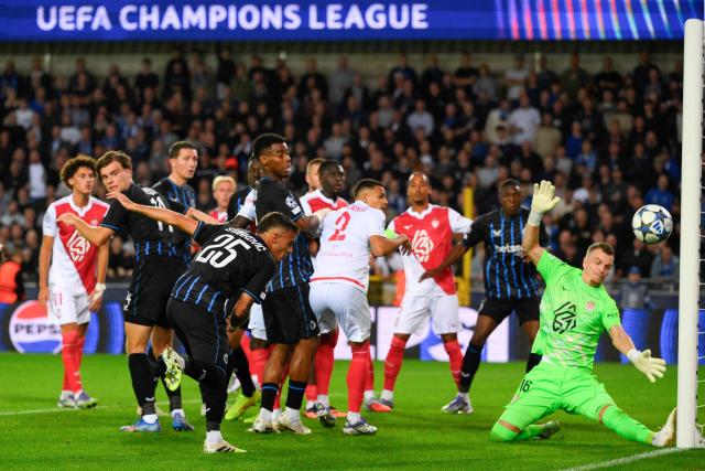 Club Brugge's Serbian midfielder #25 Aleksandar Stankovi? tries to shoot against Monaco's Swiss goalkeeper #16 Philipp Kohn during the UEFA Champions League first round day 1 football match between Club Brugge and AS Monaco at Jan Breydelstadion stadium, in Bruges, on September 18, 2025. (Photo by JOHN THYS / AFP)