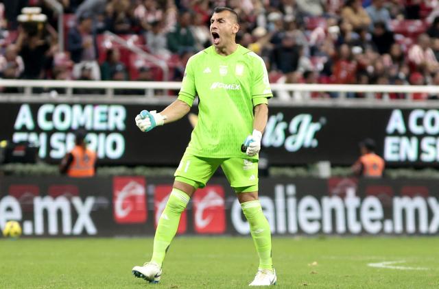 (FILES) Tigres' Argentine goalkeeper #01 Nahuel Guzman celebrates his team's first goal during the Liga MX Clausura football match between Guadalajara and Tigres at the Akron stadium in Zapopan, Jalisco state, Mexico on January 25, 2025. Argentinian goalkeeper Nahuel Guzman increased his prestige in Mexican football by reaching 200 clean sheets with Tigres, following a 0-0 draw against Chivas de Guadalajara in the 2025 Apertura tournament on September 17, 2025. (Photo by Ulises Ruiz / AFP)