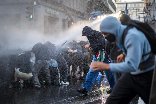 Riot police uses a water cannon to disperse an unauthorized pro-Palestinian demonstration in Lausanne on September 18, 2025. . (Photo by Fabrice COFFRINI / AFP)