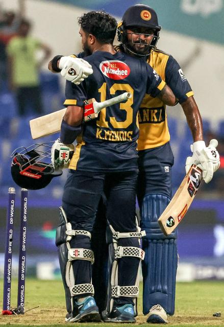 Sri Lanka's Kusal Mendis (front) and Kamindu Mendis celebrate their team's win in the Asia Cup 2025 Twenty20 international cricket match between Afghanistan and Sri Lanka at the Sheikh Zayed Cricket Stadium in Abu Dhabi on September 18, 2025. (Photo by Fadel SENNA / AFP)