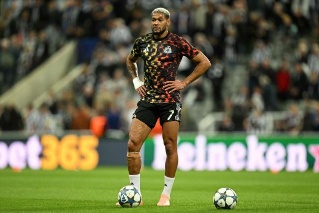 Newcastle's Brazilian forward #07 Joelinton looks on during a warm up ahead of the UEFA Champions League first round football match between Newcastle United FC and FC Barcelona at St James' Park in London, on September 18, 2025. (Photo by Oli SCARFF / AFP)