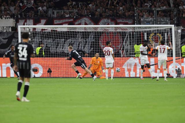 Frankfurt's German forward #09 Jonathan Burkardt (3rd L) celebrates scoring the 4-1 goal during the UEFA Champions League league phase day 1 football match between Eintracht Frankfurt and Galatasaray in Frankfurt, western Germany on September 18, 2025. (Photo by Daniel ROLAND / AFP)