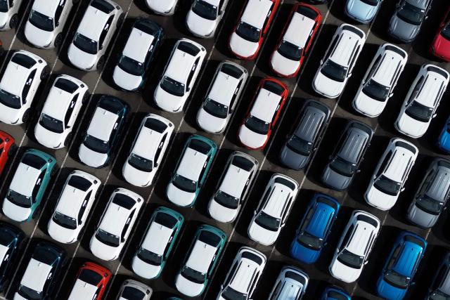 Aerial view shoeing vehicles parked in Zarate port on the banks of the Parana river, in Zarate, Buenos Aires province, on September 18, 2025. (Photo by Luis ROBAYO / AFP)