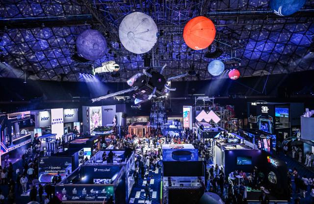 People attend the communications and technology fair in Caracas on September 18, 2025. (Photo by Juan BARRETO / AFP)