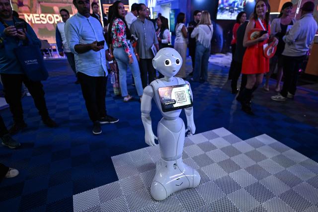 A robot is presented at the communications and technology fair in Caracas on September 18, 2025. (Photo by Juan BARRETO / AFP)