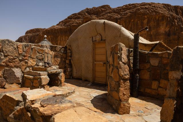 A general view od the Oundoumba camp, in the province of Ennedi Ouest, Chad, on July 10, 2025, built in Fada by the NGO African Parks, designed to accommodate tourists. A five-day scientific mission, conducted at the end of July, thirty kilometers from Fada, brought together Chadian archaeologists and geologists from the universities of N'Djamena and Abeche.
The objective: to lay "the first milestone" in the chronological markers of the ancient occupation of the Ennedi region, the researcher asserts.
The Ennedi Natural and Cultural Reserve (RNCE), created in 2018 in this Chadian province, at the crossroads with Libya and Sudan, is home to a rich archaeological heritage.
Across a sanctuary spanning more than 50,000 square kilometers, tens of thousands of rock engravings and paintings adorn the rock faces.
Following the inscription of the RNCE on the World Heritage List in 2016, the Chadian government entrusted its co-management to the South African NGO African Parks for fifteen years. (Photo by Joris Bolomey / AFP)