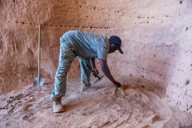 Djimet Guemona, 35, an archeologist, clears the area where an archaeological dig will take place at the Garoa Hallagana rock art site, in Ennedi Ouest province, Chad, on July 10, 2025. A five-day scientific mission, conducted at the end of July, thirty kilometers from Fada, brought together Chadian archaeologists and geologists from the universities of N'Djamena and Abeche.
The objective: to lay "the first milestone" in the chronological markers of the ancient occupation of the Ennedi region, the researcher asserts.
The Ennedi Natural and Cultural Reserve (RNCE), created in 2018 in this Chadian province, at the crossroads with Libya and Sudan, is home to a rich archaeological heritage.
Across a sanctuary spanning more than 50,000 square kilometers, tens of thousands of rock engravings and paintings adorn the rock faces.
Following the inscription of the RNCE on the World Heritage List in 2016, the Chadian government entrusted its co-management to the South African NGO African Parks for fifteen years. (Photo by Joris Bolomey / AFP)