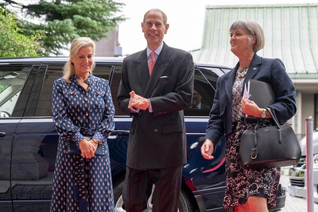 Britain's Prince Edward, Duke of Edinburgh (C) and his wife Princess Sophie, Duchess of Edinburgh (L), are welcomed by Britain's Ambassador to Japan Julia Longbottom (R) prior to the MUSUBI Initiative reception celebrating the people-to-people ties built between Japan and Britain at the British embassy in Tokyo on September 19, 2025. (Photo by Kazuhiro NOGI / AFP)