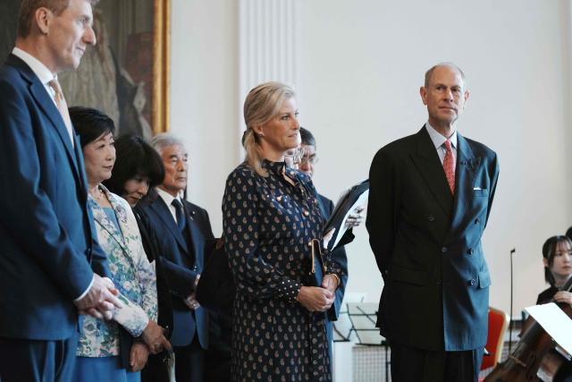 Britain's Prince Edward, Duke of Edinburgh (R) and his wife Princess Sophie, Duchess of Edinburgh (2nd R), attend the MUSUBI Initiative reception celebrating the people-to-people ties built between Japan and Britain at the British embassy in Tokyo on September 19, 2025. (Photo by Kazuhiro NOGI / AFP)