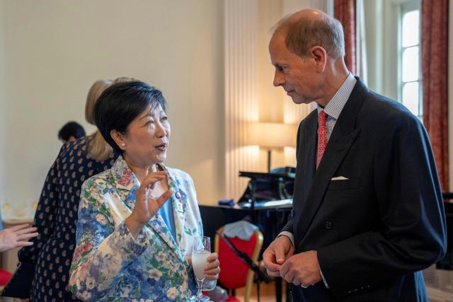 Britain's Prince Edward, Duke of Edinburgh (R), chats with Tokyo Governor Yuriko Koike at the MUSUBI Initiative reception celebrating the people-to-people ties built between Japan and Britain at the British embassy in Tokyo on September 19, 2025. (Photo by Kazuhiro NOGI / AFP)