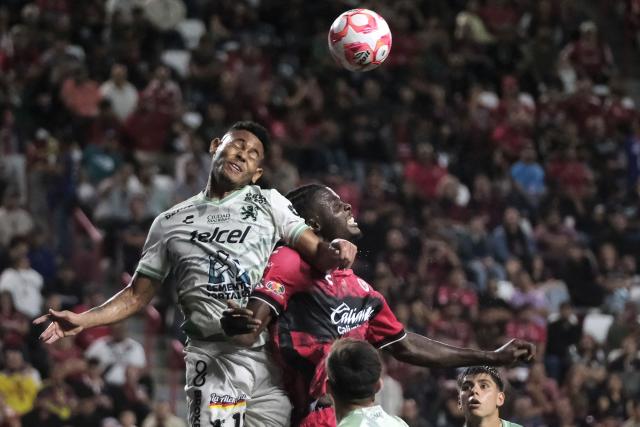 Leon's Panamanian forward #11 Ismael Diaz and Tijuana's Cameroonian midfielder #34 Frank Boya fight for the ball during the Liga MX Apertura tournament football match between Tijuana and Leon at the Caliente Stadium in Tijuana, Baja California, Mexico on September 19, 2025. (Photo by Guillermo Arias / AFP)