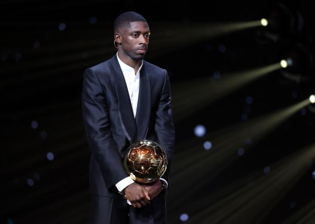 Paris Saint-Germain's French forward Ousmane Dembele reacts after receiving the Ballon d'Or award during the 2025 Ballon d'Or France Football award ceremony at the Theatre du Chatelet in Paris on September 22, 2025. (Photo by FRANCK FIFE / AFP)