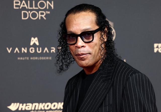 Brazilian former football player Ronaldinho poses upon arrival before the 2025 Ballon d'Or France Football award ceremony at the Theatre du Chatelet in Paris on September 22, 2025. (Photo by FRANCK FIFE / AFP)