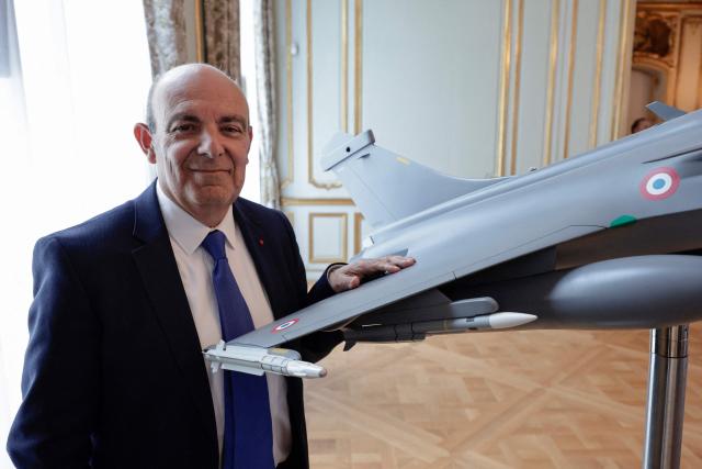(FILES) CEO of Dassault Aviation Eric Trappier poses for photograph next to a model aircraft as he attends the General Assembly for Dassault Aviation, at the company's headquarters in Paris, on May 16, 2024. Dassault is capable of building the future European fighter jet ‘all by itself from A to Z’, the group's CEO Eric Trappier said on September 23, 2025, while Germany and Spain consider the European project to be stalled. ‘The answer is yes,’ said Trappier when asked whether Dassault, the manufacturer of the Rafale, could build a sixth-generation fighter jet ‘all by itself’. (Photo by STEPHANE DE SAKUTIN / AFP)