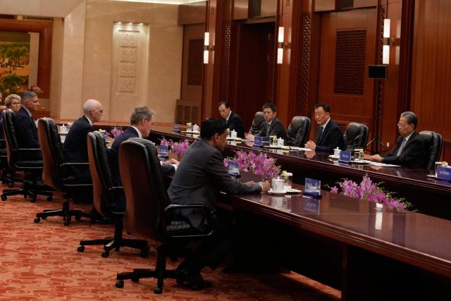 US Representative Adam Smith (3rd L) leads a bipartisan group of US lawmakers in a meeting with Zhao Leji, Chairman of China’s National People’s Congress Standing Committee, at the Great Hall of the People in Beijing on September 23, 2025. (Photo by Mahesh Kumar A. / POOL / AFP)