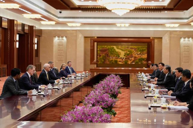 Zhao Leji (3rd R), Chairman of China’s National People’s Congress Standing Committee, speaks with US Representative Adam Smith (3rd L) during a meeting with a bipartisan group of US lawmakers at the Great Hall of the People in Beijing on September 23, 2025. (Photo by Mahesh Kumar A. / POOL / AFP)