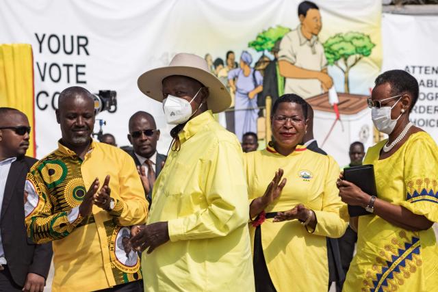 Ugandan President Yoweri Museveni (3rd R) arrives at the electoral commission offices in Wakiso on September 23, 2025, to be officially nominated as a candidate for his seventh term in office. (Photo by BADRU KATUMBA / AFP)