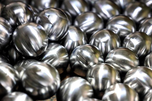 (FILES) This photo taken on November 8, 2023 shows petanque balls at Football Thai (FBT) Factory Sporting Goods in Bangkok. Thailand's sports authority said September 23, 2025 it would seek to "clarify misunderstandings" after the world governing body of petanque effectively barred the nation from hosting competition in the sport at this year's SEA Games. (Photo by Valeria Mongelli / AFP)