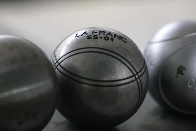 (FILES) This photo taken on November 8, 2023 shows petanque balls at Football Thai (FBT) Factory Sporting Goods in Bangkok. Thailand's sports authority said September 23, 2025 it would seek to "clarify misunderstandings" after the world governing body of petanque effectively barred the nation from hosting competition in the sport at this year's SEA Games. (Photo by Valeria Mongelli / AFP)