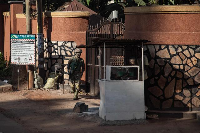 A Ugandan Military police officer stands guard in Lweza, Wakiso, on September 23, 2025, as Ugandan President Yoweri Museveni receives his nomination from the electoral commission. (Photo by BADRU KATUMBA / AFP)