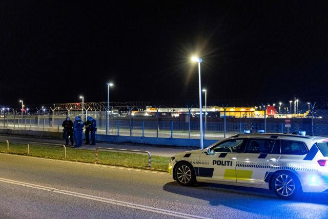 The Danish police are seen at Copenhagen Airport, in Kastrup near Copenhagen, on September 22, 2025. Large drones that flew over Copenhagen airport for hours and caused it to shut down constituted the "most serious attack on Danish critical infrastructure" to date, Prime Minister Mette Frederiksen said on September 23, 2025. Airports in Copenhagen and Oslo reopened early on September 23, hours after unidentified drones in their airspace caused dozens of flights to be diverted or cancelled, disrupting thousands of passengers. (Photo by Steven Knap / Ritzau Scanpix / AFP) / Denmark OUT
