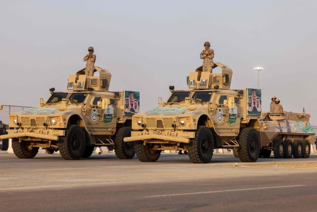 Saudi Interior ministry Forces parade during celebrations marking Saudi Arabia's 95th National Day celebrations in Banban at the edges of Riyadh on September 23, 2025.  (Photo by Fayez Nureldine / AFP)