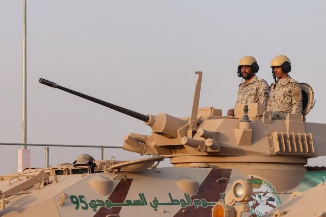 Saudi Interior ministry Forces parade during celebrations marking Saudi Arabia's 95th National Day celebrations in Banban at the edges of Riyadh on September 23, 2025.  (Photo by Fayez Nureldine / AFP)