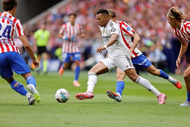 Real Madrid's French forward #10 Kylian Mbappe controls the ball during the Spanish league football match between Club Atletico de Madrid and Real Madrid CF at the Metropolitano stadium in Madrid on September 27, 2025. (Photo by Oscar DEL POZO / AFP)