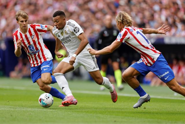 Real Madrid's French forward #10 Kylian Mbappe controls the ball during the Spanish league football match between Club Atletico de Madrid and Real Madrid CF at the Metropolitano stadium in Madrid on September 27, 2025. (Photo by Oscar DEL POZO / AFP)