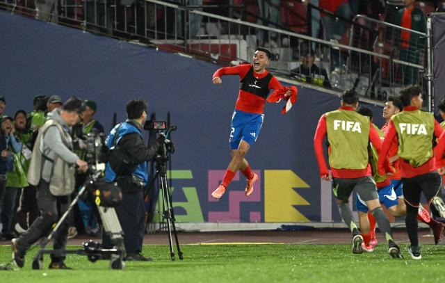 Chile's defender #02 Ian Garguez celebrates scoring his team's second goal during the 2025 FIFA World Cup U-20 football match between Chile and New Zealand at the National Stadium in Santiago on September 27, 2025. (Photo by RODRIGO ARANGUA / AFP)