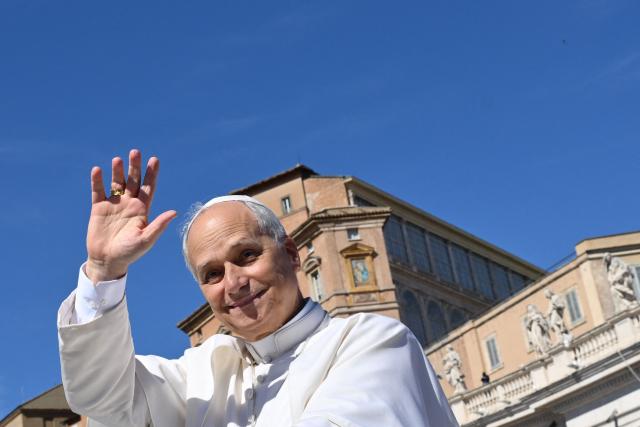 Pope Leo XI waves at the audience at the end of the Jubilee mass for the catechist at St. Peters’ square in the Vatican on September 28, 2025. (Photo by Alberto PIZZOLI / AFP)