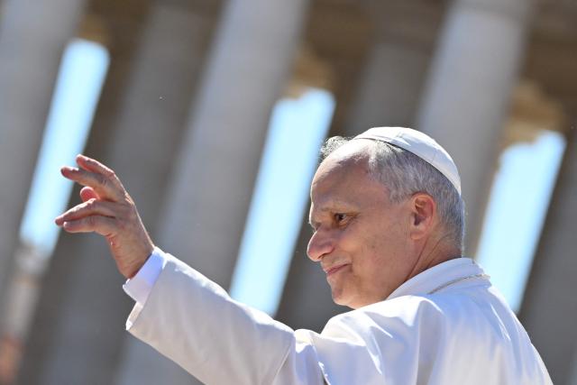 Pope Leo XI waves at the audience at the end of the Jubilee mass for the catechist at St. Peters’ square in the Vatican on September 28, 2025. (Photo by Alberto PIZZOLI / AFP)