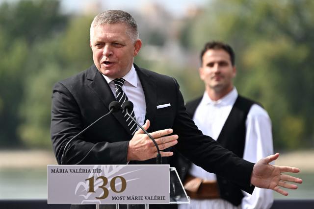 Slovak Prime Minister Robert Fico delivers a speech during a ceremony to celebrate the 130th anniversary of the Maria Valeria Bridge that connects the Slovak town of Sturovo with the Hungarian town of Esztergom, near the countries' common border in Esztergom, Hungary on September 28, 2025. The bridge links the two countries across the Danube river. It was opened on September 28, 1895. (Photo by Attila KISBENEDEK / AFP)
